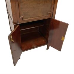 Edwardian mahogany drinks cabinet, the moulded rectangular top hinges to reveal lift-up tray with decanter and glass holder, the front with applied geometric mouldings, fitted with double cupboard with matching mouldings on square tapering supports with brass castors