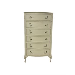 French style cream and gilt bow front chest, the gilt edged top over six drawers, raised on cabriole supports W70cm, H125cm, D47cm 
