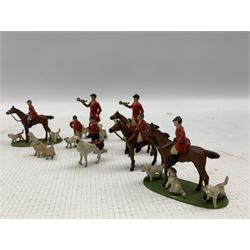 Quantity of lead hunting figures including on horseback and hounds, set of painted lead figures modelled as a seated jazz band and a figure modelled as a tabby cat in guard outfit