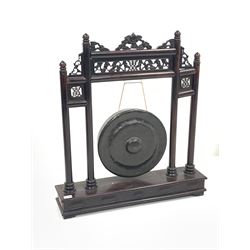 Late 19th/Early 20th century Chinese bronze gong, the hardwood frame with pierced fretwork decoration on rectangular base, with two beaters W79cm