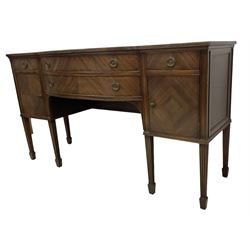 19th century mahogany sideboard, shaped rectangular top with reeded edge, fitted with two bow-front drawers flanked by cupboards, raised on fluted moulded square tapering supports with spade feet