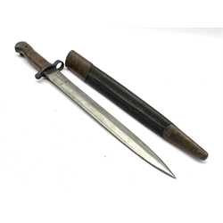 British Lee Metford bayonet stamped with various marks including EDF, with wooden mounted grip and leather scabbard, 43cm long overall