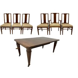 Edwardian mahogany telescopic extending dining table with additional leaf, raised on square tapering inlaid supports on brass castors (123cm x 104cm x 72cm); and set six (4+2) Edwardian mahogany dining chairs with boxwood stringing, seats upholstered in cream patterned fabric (50cm x 48cm x 104cm)