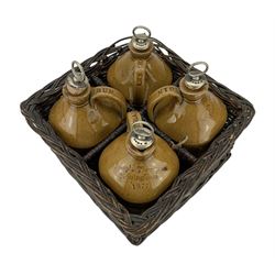Set of four Victorian stoneware spirit flasks, by Joseph Thompson, Nottingham, 1887, of rounded square form, with plated stoppers, impressed Brandy, Gin, Rum and Whiskey, housed in original four section wicker basket, W26cm, L26cm, H14cm