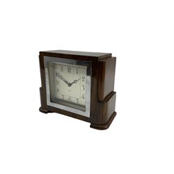 English walnut cased 8-day mantle clock with a square chrome bezel , silvered dial and Arabic numerals, spring driven movement wound and set from the rear.