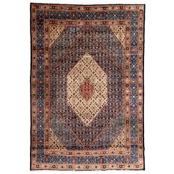 Persian Mood indigo ground rug, the field in the form of stepped lozenges and decorated with repeating floral Herati motifs, the main border decorated with further Herati motifs with guard bands