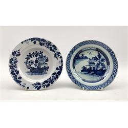 Two 18th century Delft tin-glazed plates, one having Chinoiserie decoration within a geometric border and the other with floral design, D23.5cm max (2)
