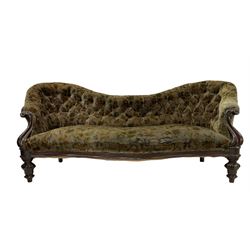 Victorian rosewood serpentine settee, upholstered in buttoned floral fabric with sprung seat, scrolled arm terminals with foliate moulding, raised on baluster turned feet