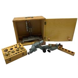 Travelling microscope by Philip Harris, Birmingham in wooden case, binocular microscope by Watson, Barnet with bench clamp and a box of brass weights