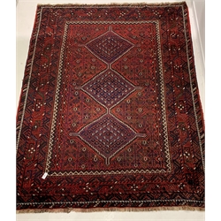 Persian hand knotted ground carpet, with pole medallion on red field, enclosed by multi line border, 240cm x 313cm