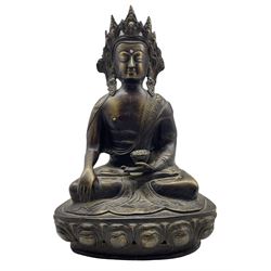 Chinese bronze buddha seated cross legged holding a censer and on a lotus base H37cm