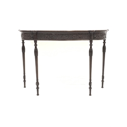 Rosewood serpentine console table, frieze intricately carved with interlaced foliate and acanthus leaves issuing from urn, raised on leaf capped turned supports, W122cm