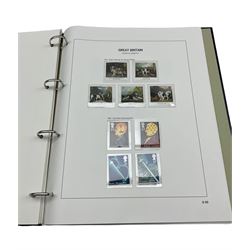 Queen Elizabeth II mint decimal stamps, many in Royal Mail presentation packs, face value of usable postage approximately 235 GBP, housed in two albums and a ring binder folder