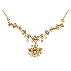Edwardian 15ct gold floral pearl and split pearl necklace, stamped 15, suspending a detachable flower pendant