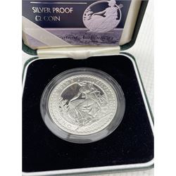 Queen Elizabeth II 2005 silver proof one ounce Britannia, 2005 silver proof twenty pence Britannia, both cased with certificates, 2004 silver bullion one ounce Britannia, on card, ten 1986 two pound coins and twenty commemorative crowns
