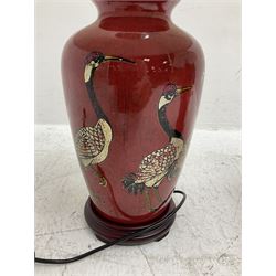 Pair of large table lamps of tapering form, decorated with cranes upon a red ground, upon circular footed base, H76cm 