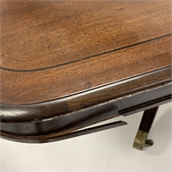  Georgian mahogany breakfast table, the top with ebonised stringing, raised on four turned columns and four splayed supports terminating in brass cup castors, 155cm x 126cm, H76cm  