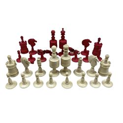 Early 20th century stained and natural bone chess pieces, not complete 