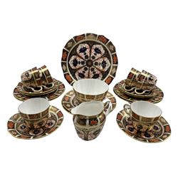 Royal Crown Derby tea set of Imari design comprising six cups and saucers, six plated, milk jug, sugar bowl and bread and butter plate