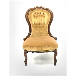 Late Victorian mahogany spoon back upholstered chair, covered in buttoned yellow velvet, raised on cabriole front supports and castors, W61cm
