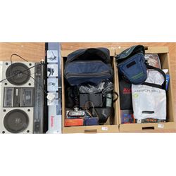 Hitachi Stereo Radio Cassette Recorder, boxed tripod, Canon EOS 500 with a 28-80mm lens, Binatone game, microphones Halina 35X film camera, Sigma 70-300mm lens, Praktica MTL3 and other accessories in two boxes