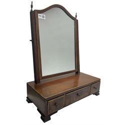 Edwardian mahogany swing mirror, two uprights surmounted by brass finials over base with three drawers, raised on bracket supports 