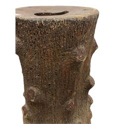 Large terracotta garden pedestal or planter in the form of a tree trunk 