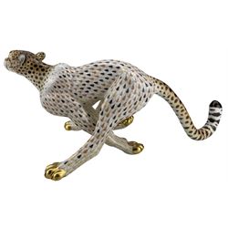Herend model of a large running Cheetah, the body painted in a butterscotch and black fishnet scale pattern, inscribed no. 15656, painted 15656-0-00/VHSP32, H15.5cm x L37cm