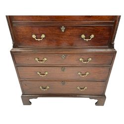 George III mahogany chest on chest, the projecting dentil cornice over blind fretwork frieze and canted corners, two short and six long drawers, cast gilt metal cartouche escutcheons and ornate handles, on bracket feet