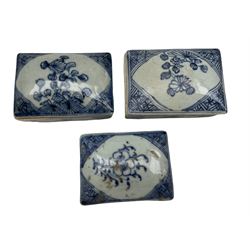 Three 18th/ 19th century Chinese rectangular blue and white boxes, all having inscriptions to the interior and floral decoration to the cover, L11cm max (3)