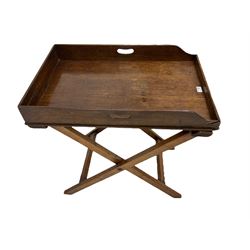 George III and later oak butlers tray with pierced handles on a walnut folding stand 