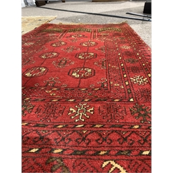 Afghan red prayer rug, with with central mihrab panel and gul motif, (77cm x 130cm) together with an eastern ground rug with hereti motif, on ivory field (120cm x 180cm) and a red tribal design hearth rug, (60cm x 116cm)