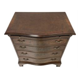 Georgian style figured walnut serpentine bachelor's chest, the moulded top over slide and four graduating drawers, enclosed by canted corners with fluting, lower moulding on bracket feet