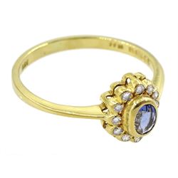 18ct gold oval sapphire and round brilliant cut diamond cluster ring, London 1986