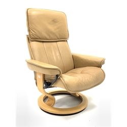 Stressless reclining armchair upholstered in tan leather, (W78cm) together with a matching footstool 