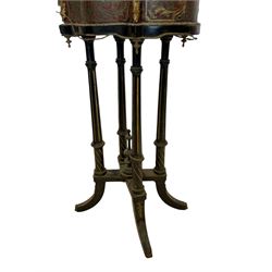 19th century ebonised and red Boulle work jardiniere or planter stand, shaped form set with raised gilt metal gallery and putti figures, on quadruple pillar base with turned central finial, splayed supports