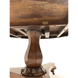 Mid 19th century burr hardwood breakfast table, circular tilt top raised on a panelled baluster pedestal with acanthus leaf carved socle, leading to a trefoil base with paw feet and castors