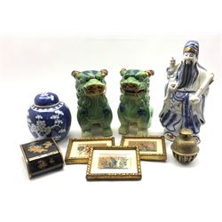 Pair of 20th century green glazed Dog of Fo, H22cm, Chinese blue and white prunus blossom pattern ginger jar and cover, Chinese brass bell, set of three framed watercolour studies of birds on rice paper etc