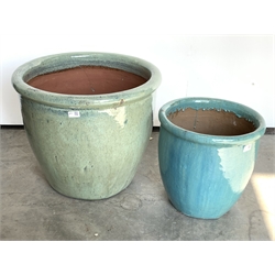  Large glazed terracotta plant pot (D59cm) and a similar pot, (D39cm)  