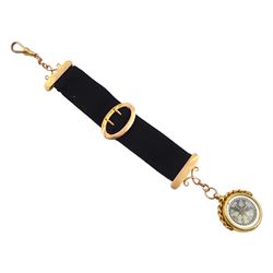 9ct gold compass, the reverse monogrammed 'JH', hallmarked on black ribbon with 9ct gold buckle and finials and clip 