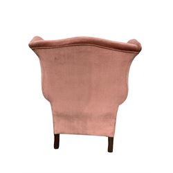 Victorian wingback armchair, upholstered in pale pink fabric with feather filled seat cushion, raised on ball and claw supports 