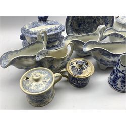 Collection of 19th century blue and white transfer wares, including Asiatic Pheasant pattern, plates and sauce boats, Willow pattern pepper pot and mustard pot, sauce tureen and stand etc 