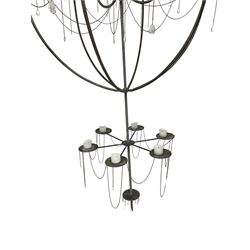Large bespoke wrought iron cage candle chandelier, the top tier with six extending branches over bell-shape cage with scrolled supports and six branches, six branch lower tier; together with ceiling winch 