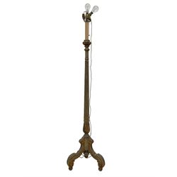 Early 20th century Italian design giltwood standard lamp, fitted with four bulb fittings, the column turned and fluted with carved tulip decoration, the tripod base with scroll cabriole supports terminating in bun feet