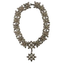 19th century cut steel necklace and pair of bracelets, possibly converted from a chatelaine, of foliate cluster links with faceted decoration (3)