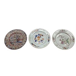 Three 18th century Chinese plates, one decorated in the Imari palette, Famille Rose example and another with European Clobbered decoration, D23cm