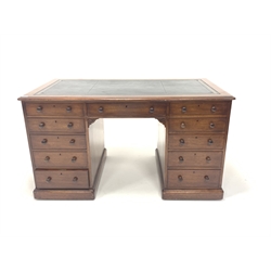 Victorian mahogany twin pedestal desk, the top wih inset tooled leather writing surface, over one long drawer and two banks of five short drawers, raised on skirted base with recessed castors, W136cm, H76cm, D73cm