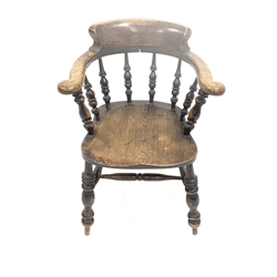 19th century stained elm and ash smokers bow armchair, with swept arms raised on spindle gallery, saddle seat over turned supports united by double 'H' stretcher, W63cm