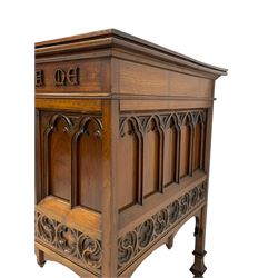 In the manner of Augustus Pugin - 19th century Gothic Revival walnut altar table, moulded rectangular top over frieze inscribed 'this do in remembrance of me', the panelled front and sides with applied tracery work, decorated with band of quatrefoil and S-scroll roundels, square supports with shaped feet