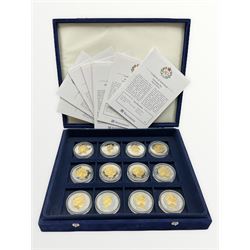 Twelve silver coins, each with gold plated detailing, all dated 2006 including Cayman Islands five dollars, Falkland Islands fifty pence, Solomon Islands twenty five dollars, Fiji five dollars etc, housed in a Westminster case, most with certificates